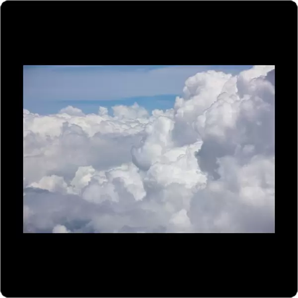 Cumulus clouds as seen from high above the tropical coastline of Costa Rica