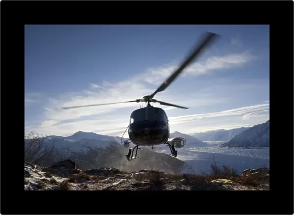 USA, Alaksa, Helicopter landing on summit of Lions Head peak above Matanuska Glacier