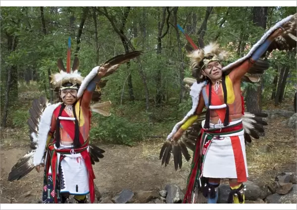 Hopi-Tewa eagle dancers dressed in traditional regalia of woven apron, sash, moccasins