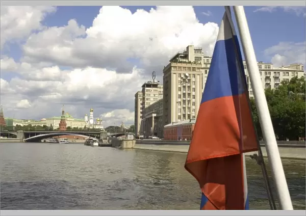 Russia. Moscow. Russian flag and the Moscow River from a tour boat