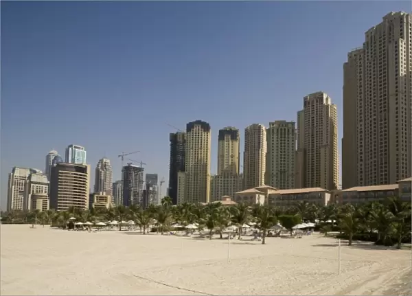 UAE, Dubai, Marina. Jumeirah Beach Residence buildings behind beach area