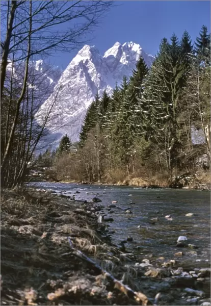 Germany, Bavaria, Zugspitze. A small stream helps frame the Zugspitze near Garmisch