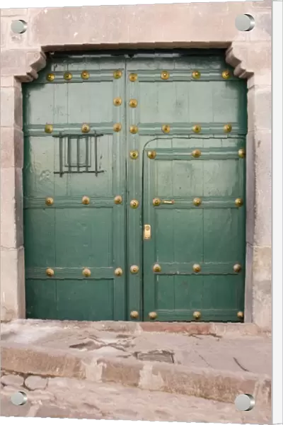 South America - Peru. Green residential door in Cusco