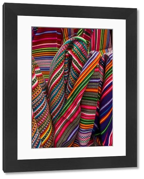Colorful blankets on display at market, Huaraz, Peru