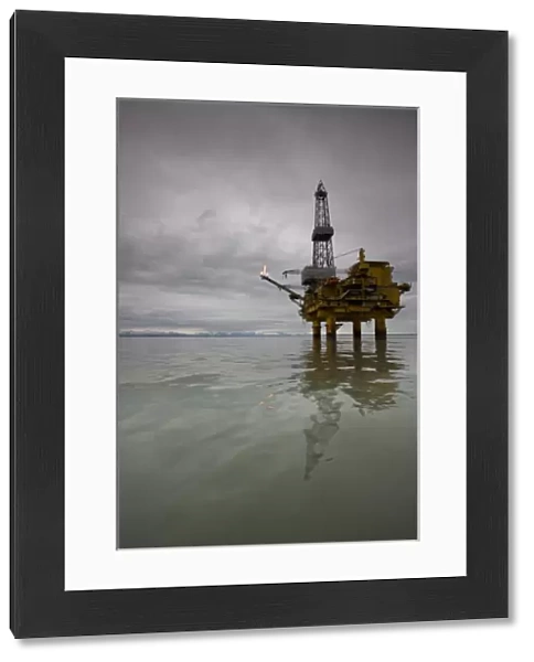 USA, Alaska, Offshore oil drilling rig in Cook Inlet on summer evening
