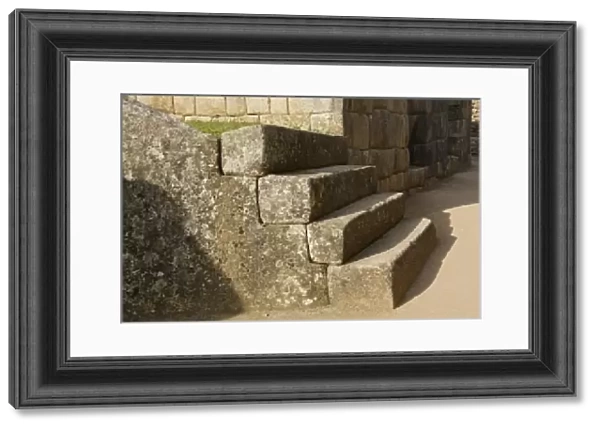 Peru, Machu Picchu, Four stone steps showing Inca craftsmanship. Credit as: Dennis