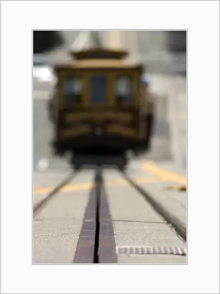 Ground level view of an approaching San Francisco cable car