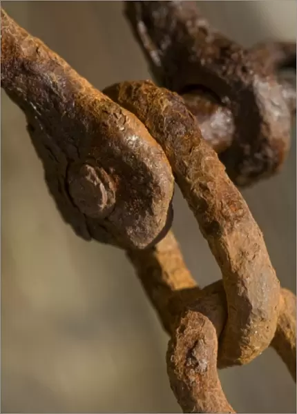 USA, Maine, Harpswell. Rusted chain on a pier