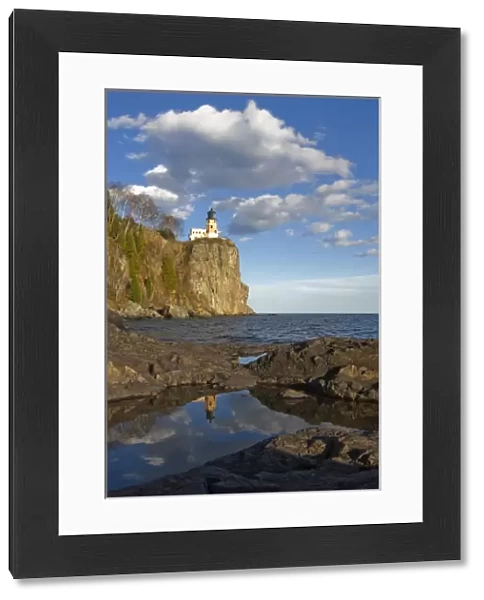 USA, Minnesota. Split Rock Lighthouse reflects in a pool on the shore of Lake Superior
