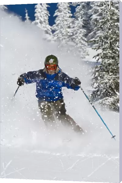 Man skiing in fresh powder at Whitefish Mountain Resort in Montana (MR)
