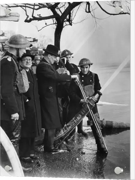 Mr Attlee attending hosepipe tests at Wimbledon, WW2
