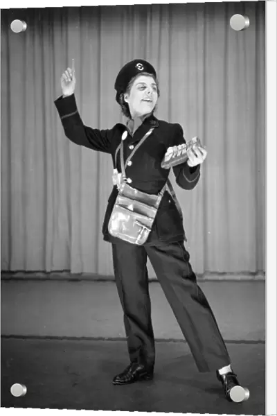 Woman performing as a bus conductor in a comic sketch