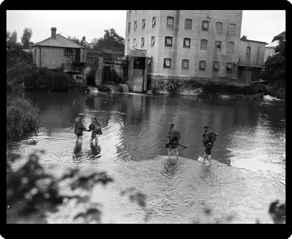 Soldiers paddling in mill pond, near Duncton, Sussex, August 1936