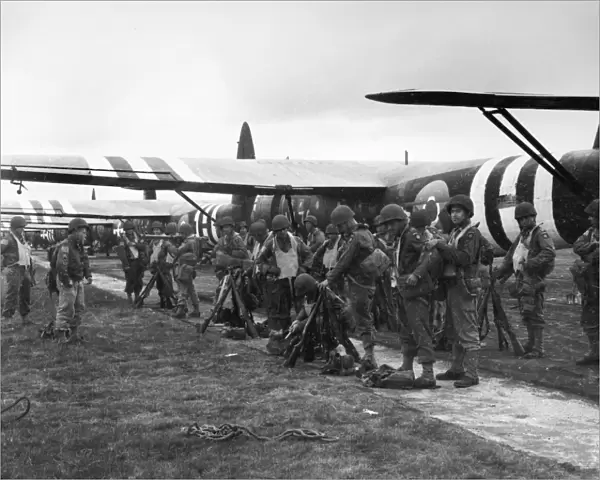 Members of the 439th Troop Carrier Group await the signal to board a CF-4 glider to take part in the invasion of Normandy. Photograph, 4 June 1944