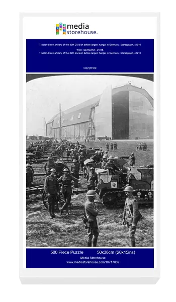 Tractor-drawn artillery of the 89th Division before largest hangar in Germany. Stereograph, c1916