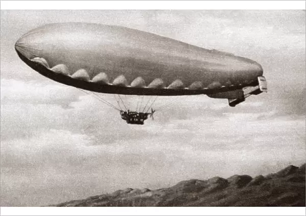 Italian dirigible in flight over the Alps near the Piave Front during World War I. Photograph, c1916