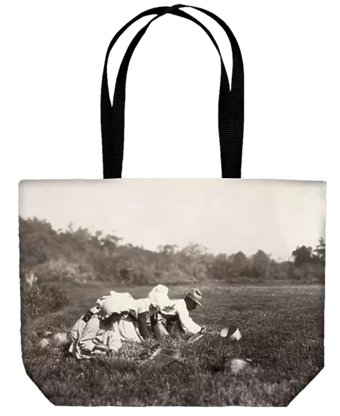 MIGRANT FAMILY, 1911. A migrant family of berry pickers at work on a cranberry