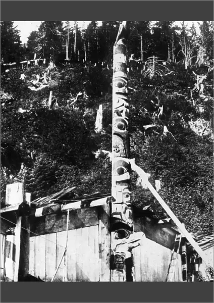 CANADA: HAIDA TOTEM POLE. Totem pole at the front of a Haida house in the village of Haina