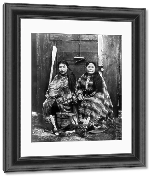 ALASKA: TLINGIT WOMEN, c1900. Two Tlingit women, wearing robes of eider duck feather