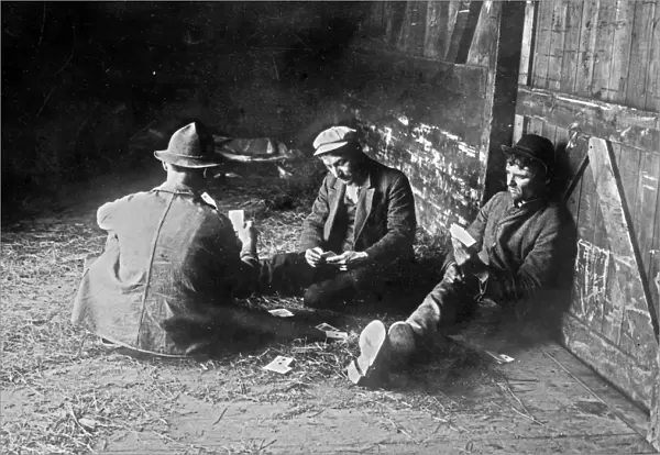 HOBOS, c1915. A group of hobos playing cards in a boxcar. Photograph, c1915