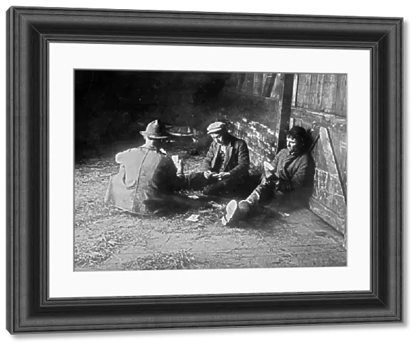 HOBOS, c1915. A group of hobos playing cards in a boxcar. Photograph, c1915