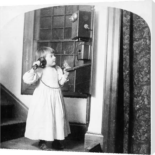 CHRISTMAS, c1892. A girl speaking to Santa Claus on a telephone on Christmas. Stereograph