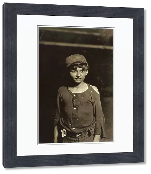 HINE: CHILD LABORER, 1908. A young worker waiting for the night shift at a glassworks