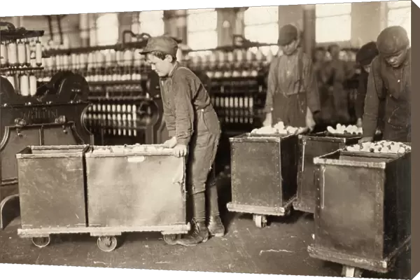 HINE: CHILD LABOR, 1908. Young doffers pushing carts filled with spools of thread