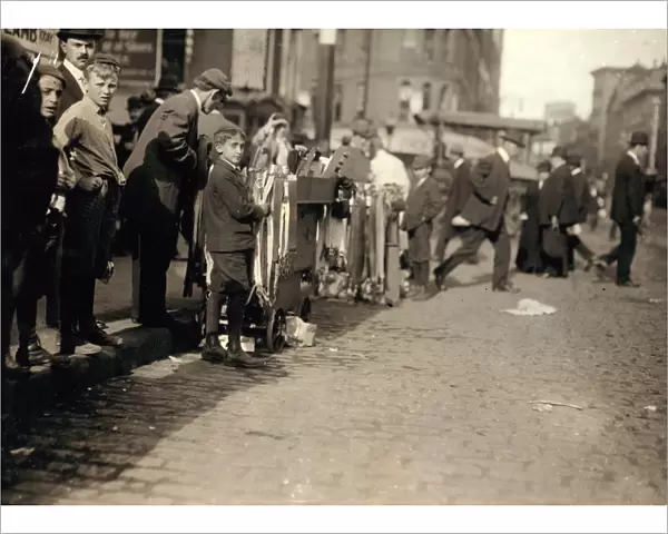 HINE: PEDDLERS, 1909. Boys peddling notions on the street in Boston, Massachusetts