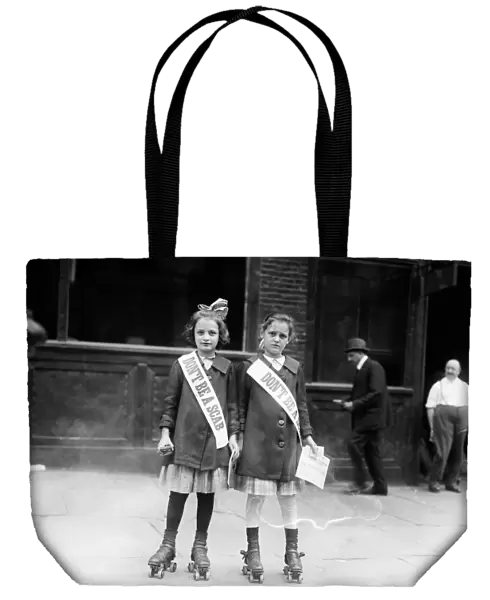 STRIKE, c1915. Two young strike sympathizers on rollerskates, probably in New York City