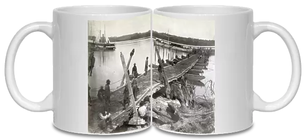 PONTOON BRIDGE, 1864. Pontoon bridge being built by the United States Military
