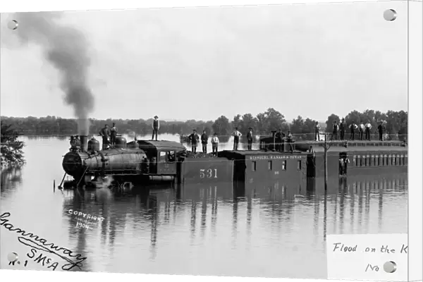 FLOOD, c1904. A train of the Missouri-Kansas-Texas Railroad under flood waters