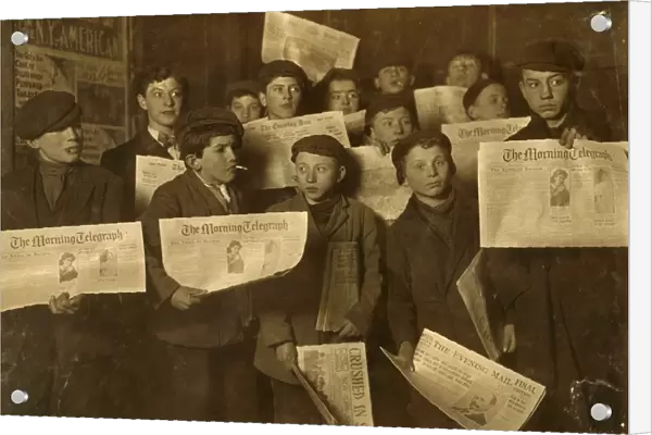 NEW YORK: NEWSBOYS, 1908. A group of newboys at the side door of the Journal Building
