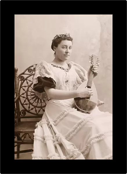 LUTE PLAYER, 19th CENTURY. Original cabinet photograph, American, late 19th century