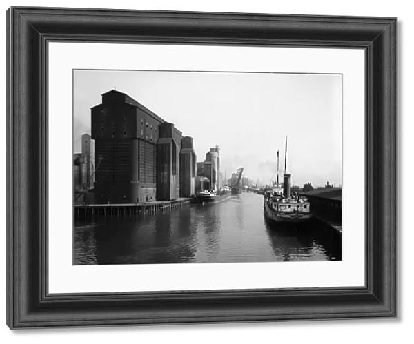 BUFFALO: CANAL HARBOR. Steamboats and grain elevators in the Canal harbor, Buffalo, New York