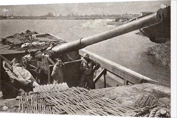 WORLD WAR I: BATTERY. Large naval gun taken from a British monitor on a floating