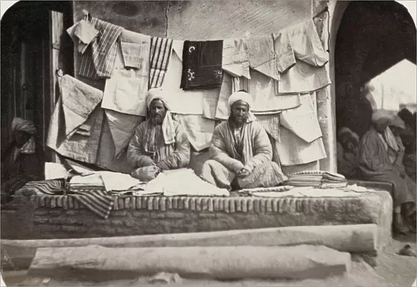 SAMARKAND: VENDOR, c1870. A vendor of shirts and other clothes at a bazaar in the