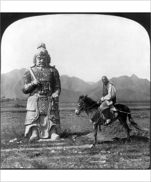 CHINA: MING TOMBS, c1907. A Chinese man on his donkey standing next to one of the