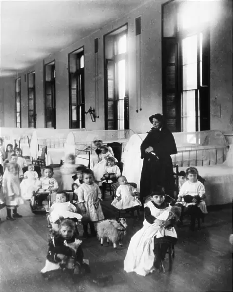 NEW YORK FOUNDLING, 1890. Sister Irene, a sister of Charity, with children at the