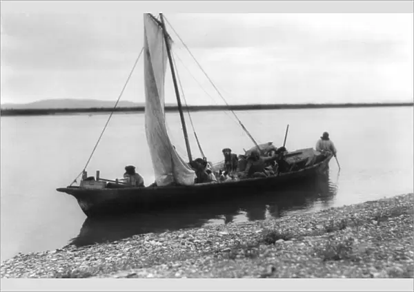 ALASKA: ESKIMO SAILBOAT. Three Eskimo men and their dogs in a sailboat starting