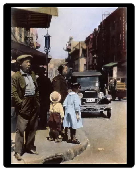 SF: CHINATOWN, 1920. A street scene in San Franciscos Chinatown: oil over a photograph