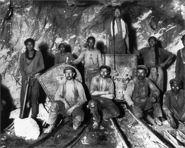 SOUTH AFRICA: GOLD MINERS. Black, Chinese, and White laborers in a gold mine in South Africa