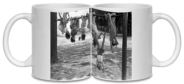 GEORGIA: PLAYGROUND, 1938. A group of schoolgirls hanging upside down in a playground