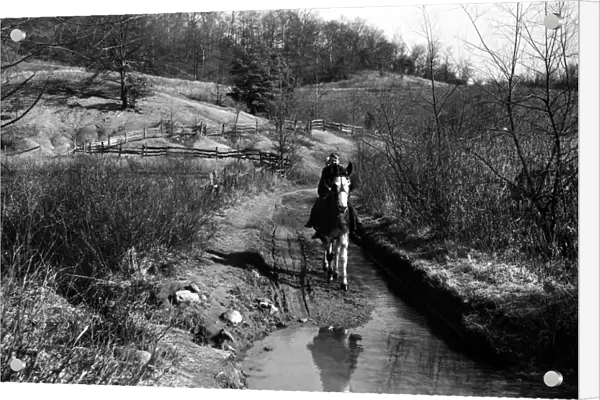 CHILDREN RIDING MULE, 1940. Two children riding a mule near Barbourville, Kentucky