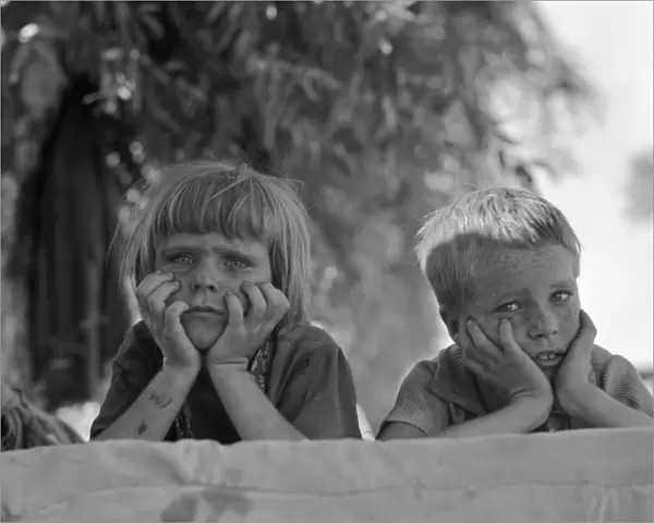 DROUGHT REFUGEES, 1936. Refugee children from Oklahoma at a migrant camp in California