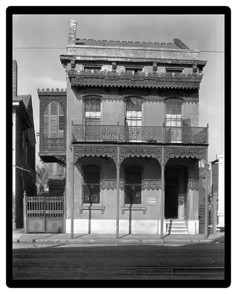 NEW ORLEANS: HOUSE, 1936. Cast iron grillwork house near Lee Circle on Saint Charles Avenue