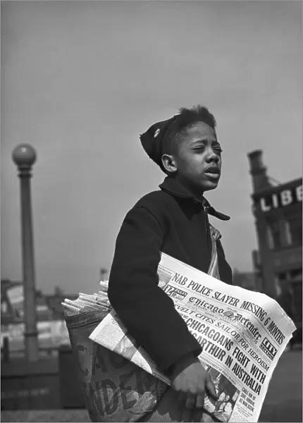 CHICAGO: NEWSBOY, 1942. Newsboy selling the Chicago Defender, a leading African