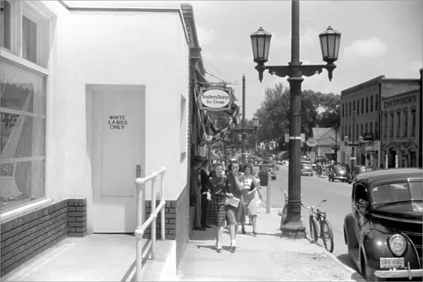 SEGREGATED ENTRANCE, 1940. Door marked white ladies only on a store in Durham, North Carolina