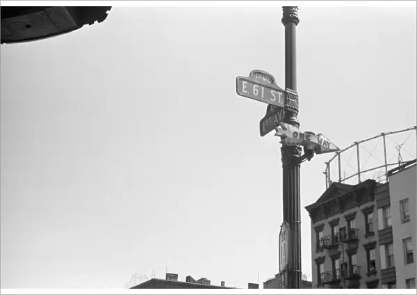EVANS: NEW YORK, 1938. Street signs on the corner of 61st Street and 1st Avenue in New York