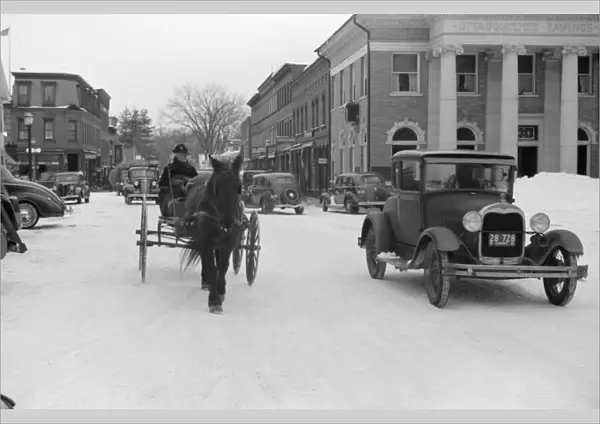 VERMONT: WOODSTOCK, 1940. Woodstock, Vermont, on Saturday afternoon after a snow storm